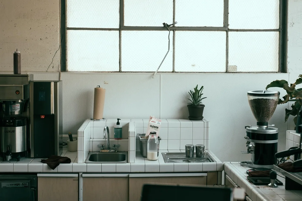kitchen, sink, faucet, tiles, coffee maker, coffee grinder, paper towels, house, coffee maker, coffee maker, coffee maker, coffee maker, coffee maker. Twelve small coffee bar ideas for a compact kitchen, each with the reason it works